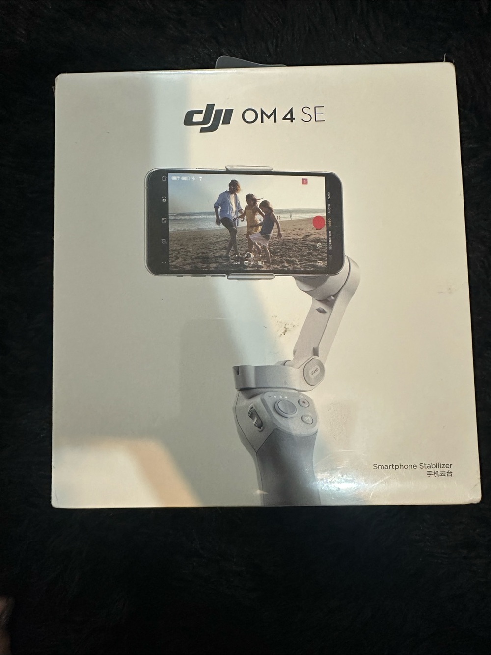 DJI white smartphone gimbal stabilizer